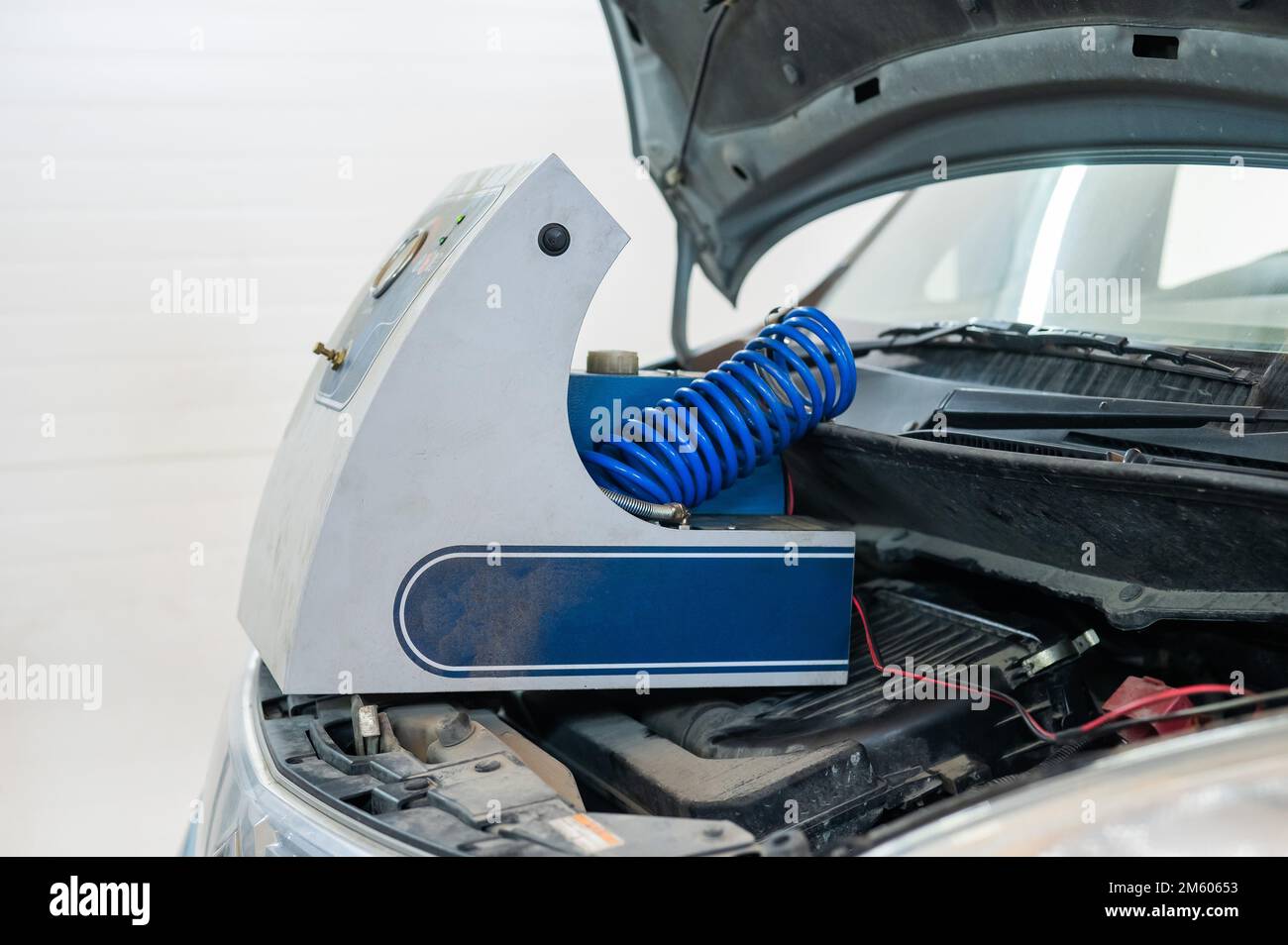 Automated change of brake fluid in a car service. Car Stock