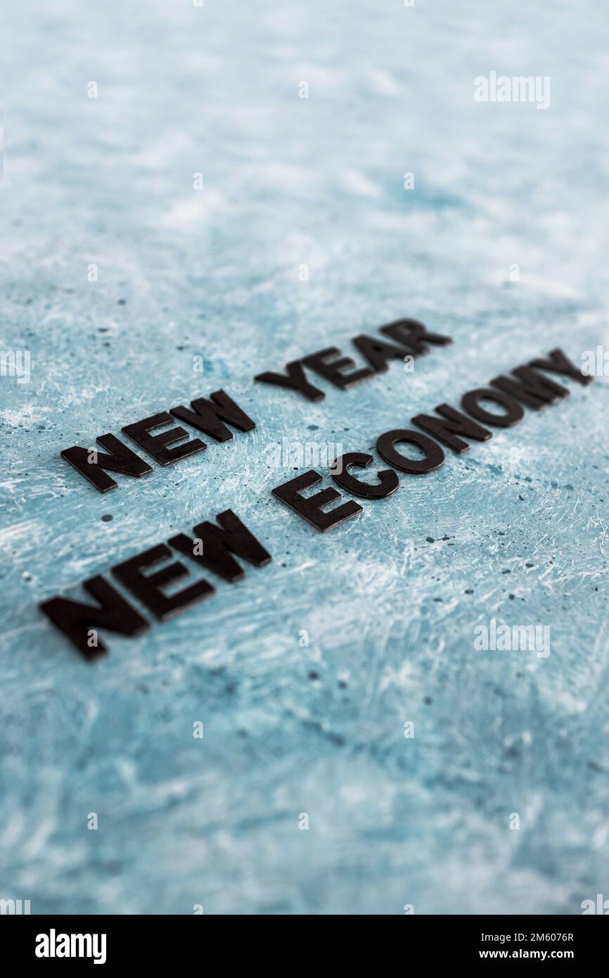 new year new economy text on grey blue background Stock Photo