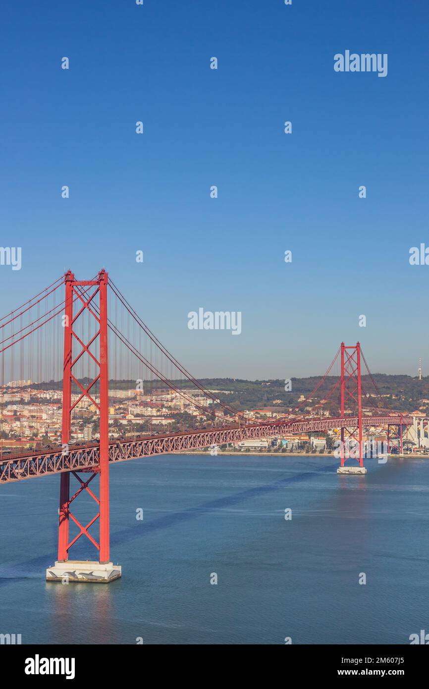 Historic red suspension bridge over the Tejo river in Lisbon, Portugal Stock Photo