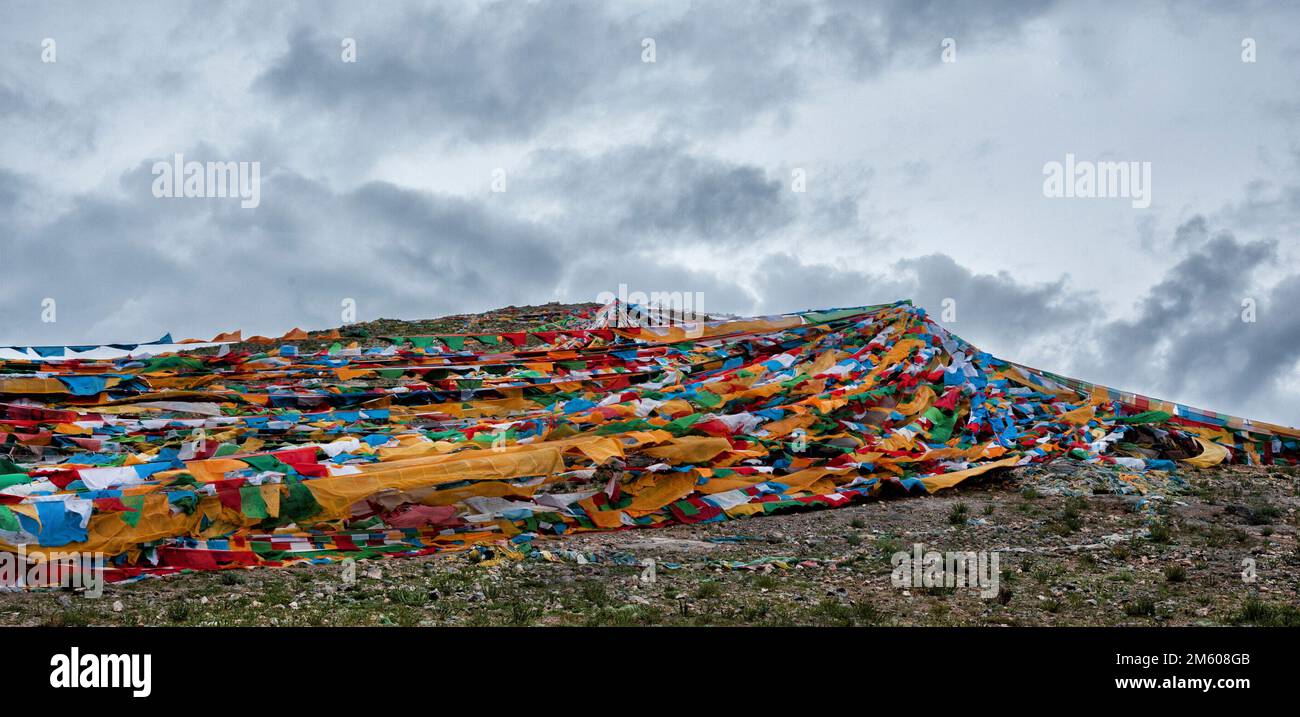 Colorful prayer flags on strings - flying in the wind on Nam Tso Lake ...