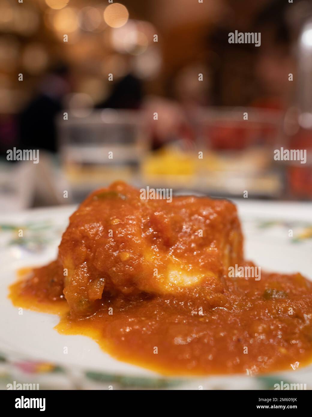 spanish cuisine. Bacalao a la vizcaina, Basque Style Cod in vertical