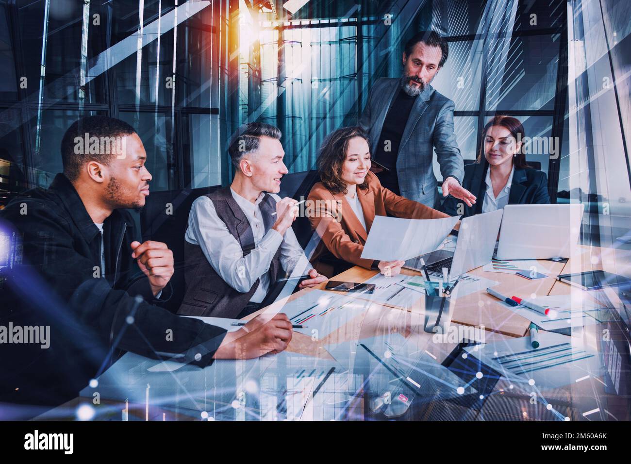 Business people in office connected on internet network analyzing statistics Stock Photo