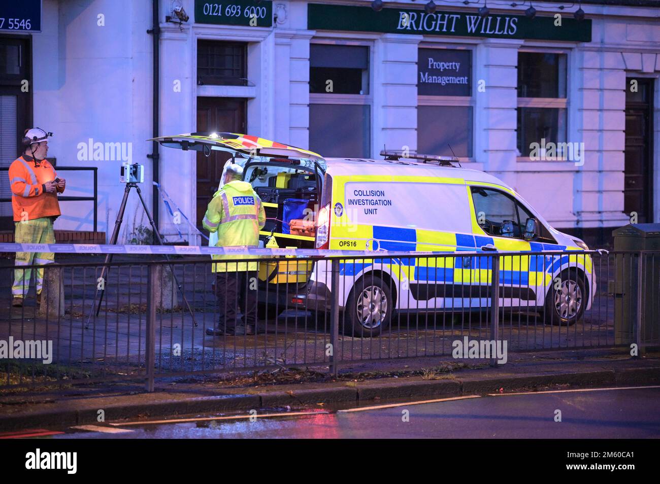 Stratford Road, Birmingham 1st January 2023. Specialist West Midlands Police Collision Investigation officers examine the scene where a man waiting at a bus stop, on Stratford Road in the Hall Green area of Birmingham, was critically injured after the driver of a silver Mercedes E220 crashed into the canopy severely injuring him less than half an hour before 2023. The 37-year-old victim remeains in hospital and the driver was arrested on suspicion of causing serious injury by dangerous driving and driving above the legal alcohol limit. The road remained closed for 9 hours after the 11.30pm hor Stock Photo