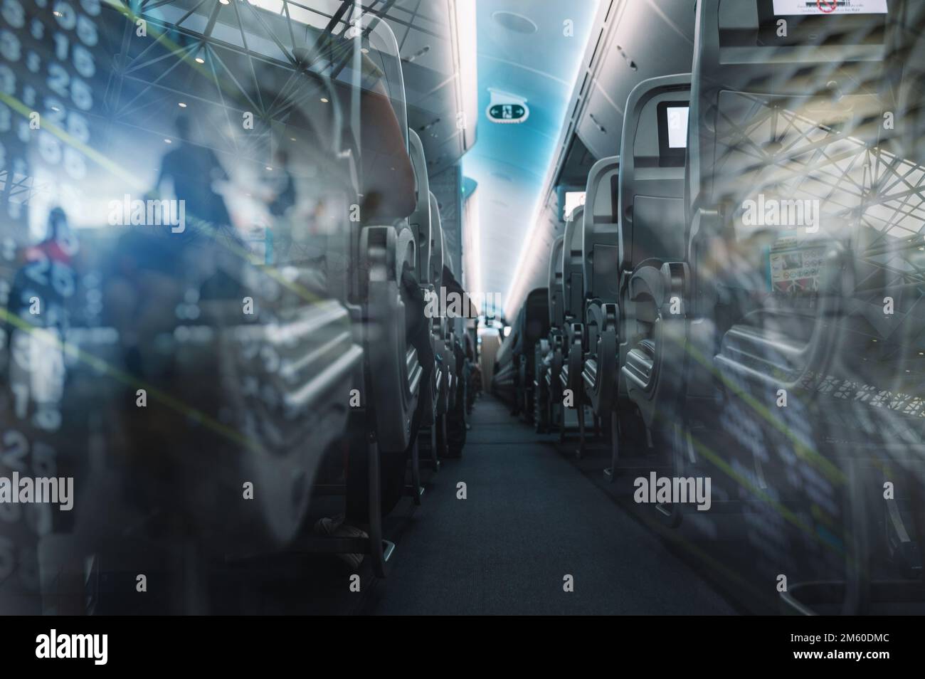 Aircraft interior with aisle and airplane seats Stock Photo