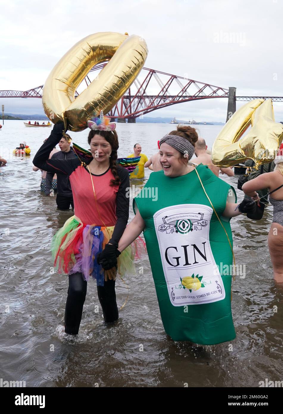 People take part in the Loony Dook New Year's Day dip in the Firth of