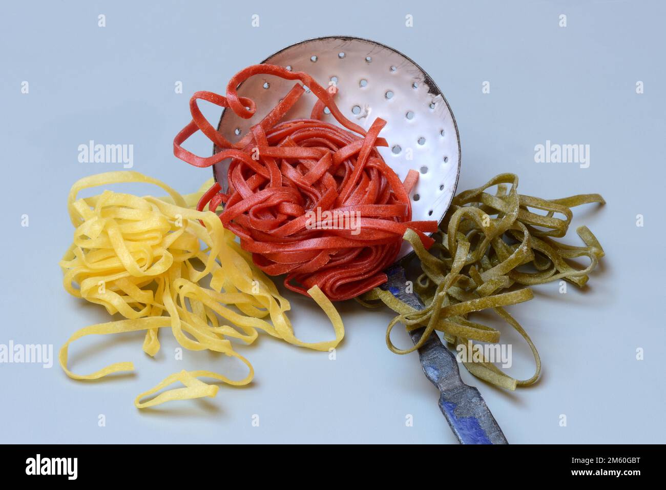 Tagliatelle tricolore, Italian pasta with sieve ladle, pasta, pasta ...