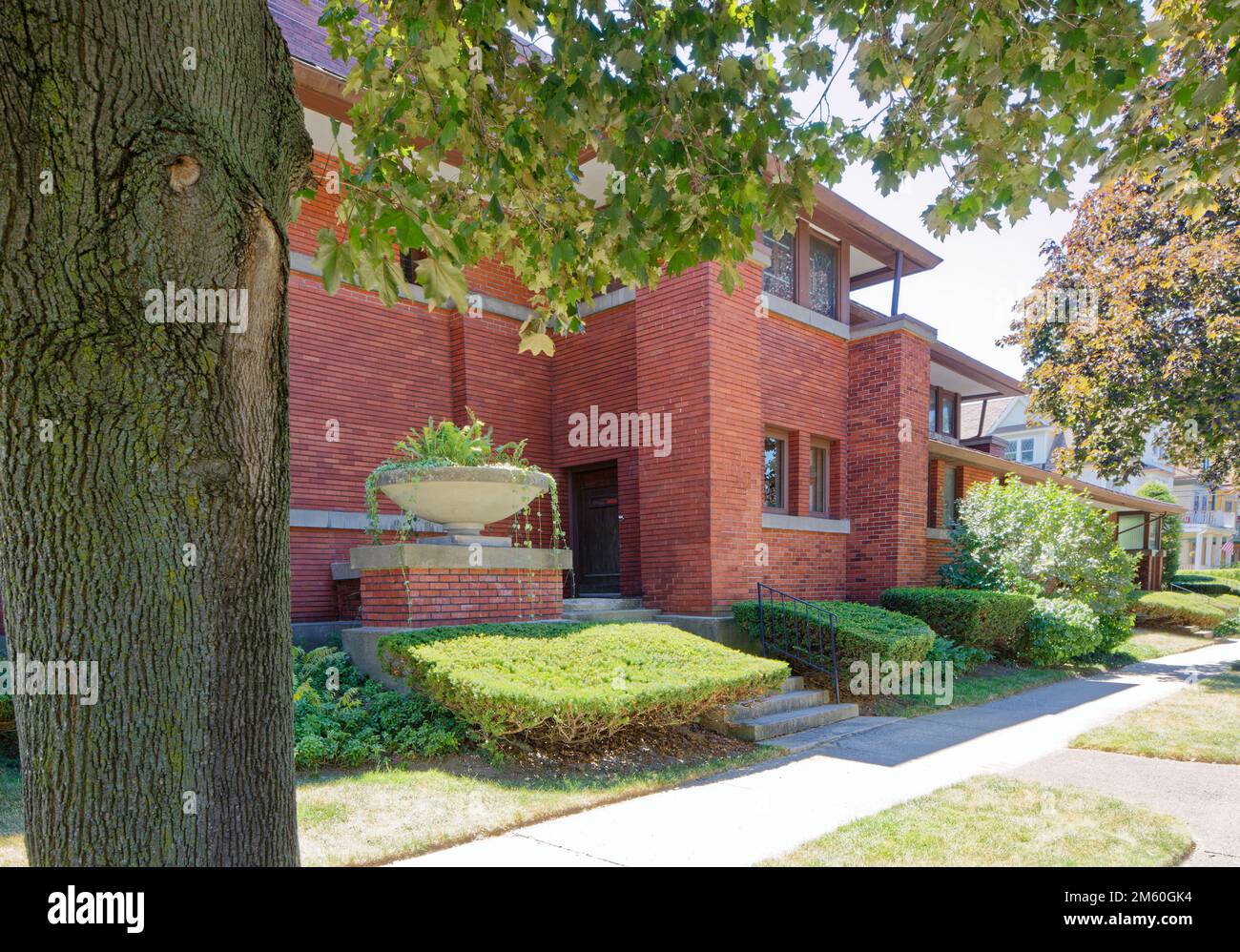 Frank Lloyd Wright’s William R. Heath House is unusual for being so close to a public street. Yet, it is built in Wright’s Prairie School style. Stock Photo