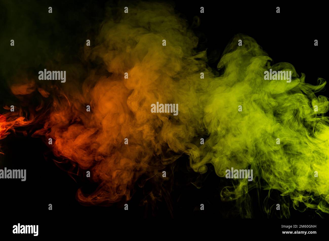 Red yellow green smoke on a black background Stock Photo - Alamy