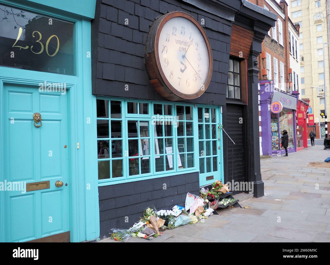 London, UK. 1st Jan, 2023. A floral and artistic tribute has been set up outside Dame Vivienne Westwood's shop in Chelsea. Credit: Brian Minkoff/Alamy Live News Stock Photo
