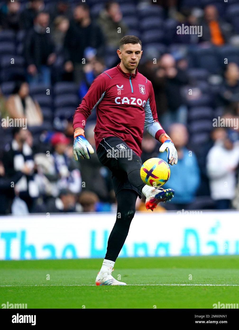 Aston Villa goalkeeper Emiliano Martinez warms up on the pitch ahead of the  Premier League match at the Tottenham Hotspur Stadium, London. Picture  date: Sunday January 1, 2023 Stock Photo - Alamy