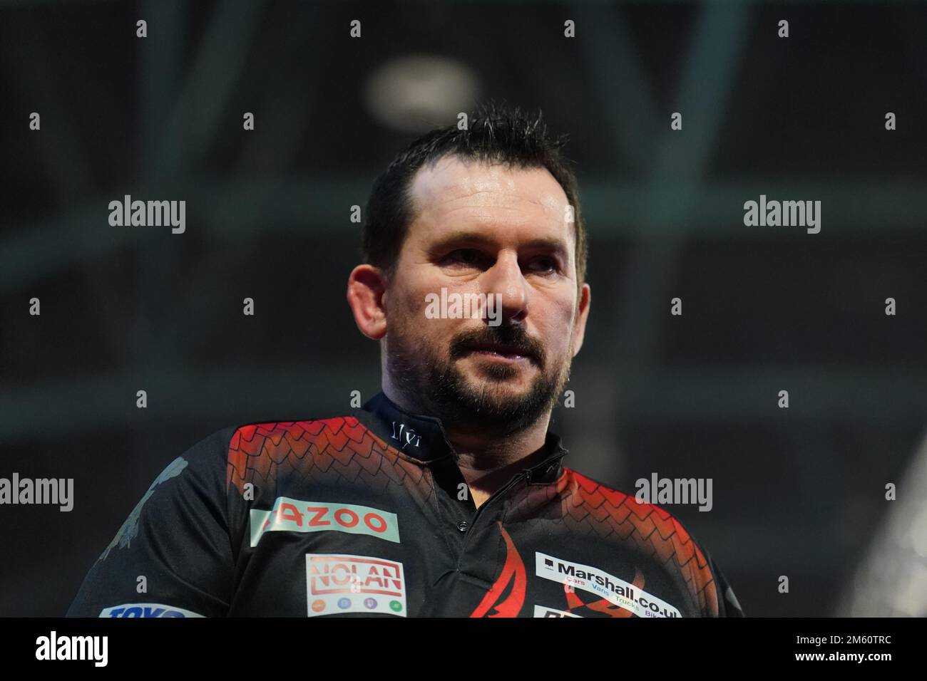 Jonny Clayton in action against Dimitri Van den Bergh during day