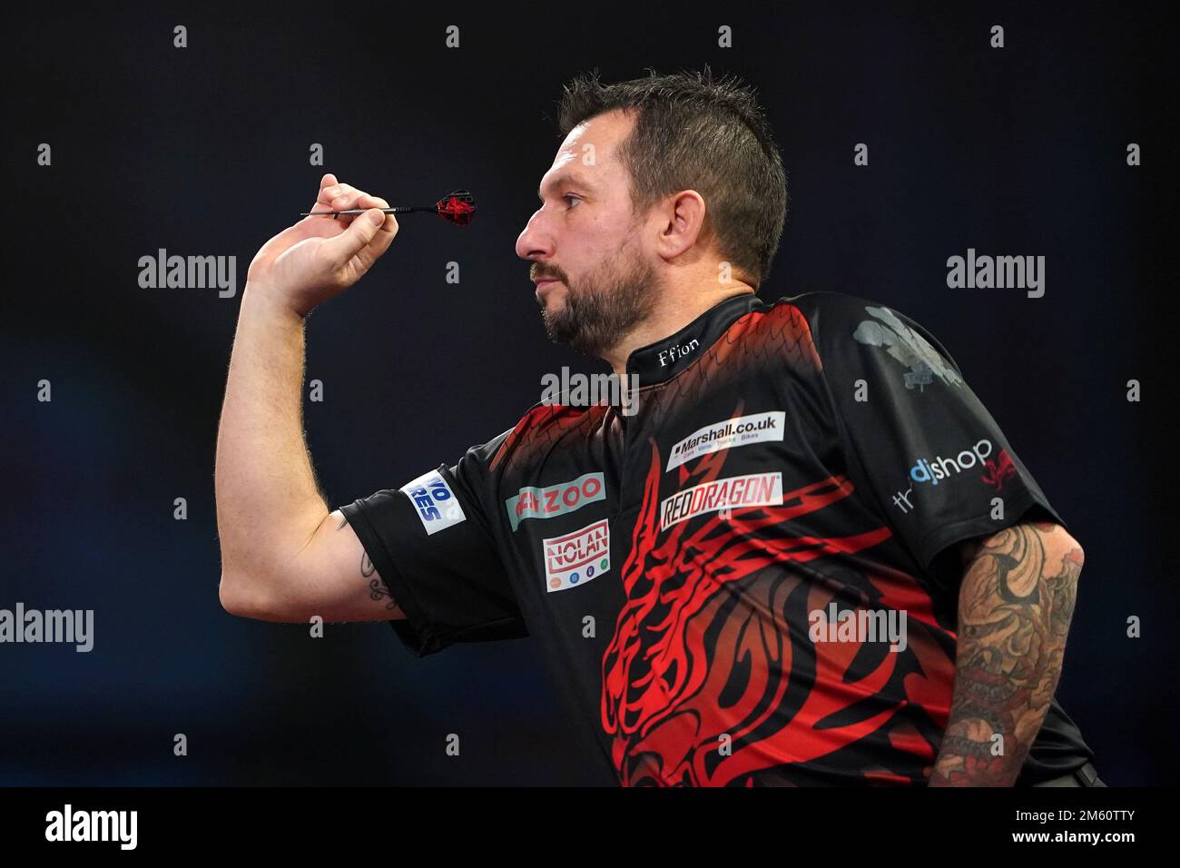 Jonny Clayton in action against Dimitri Van den Bergh during day