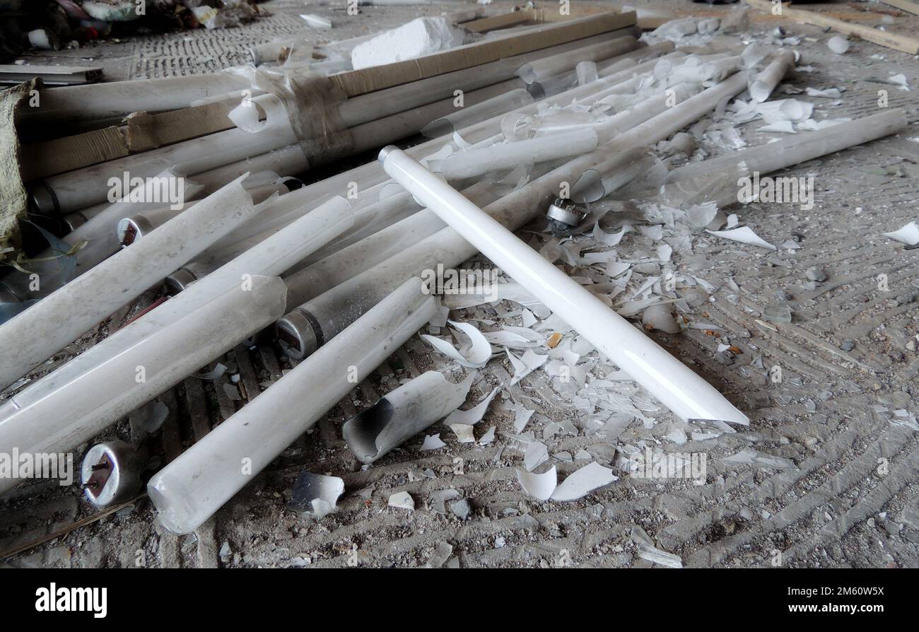 Broken Neon Tube Lamps On Concrete Floor Stock Photo Alamy