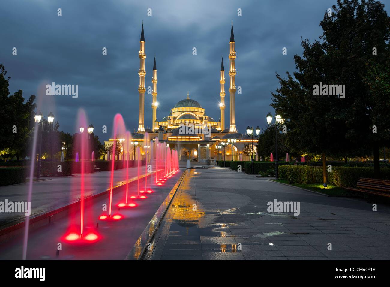 Alley of fountains and mosque of 'Heart of Chechnya' in cloudy September twilight. Grozny, Chechen Republic. Russia Stock Photo