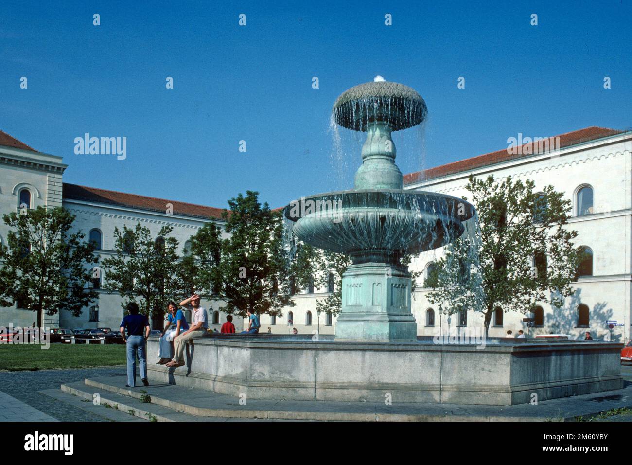 Fountain in Professor-Huberplatz in front of Ludwig-Maximilian University in 1982, Munich, Bavaria, Germany Stock Photo