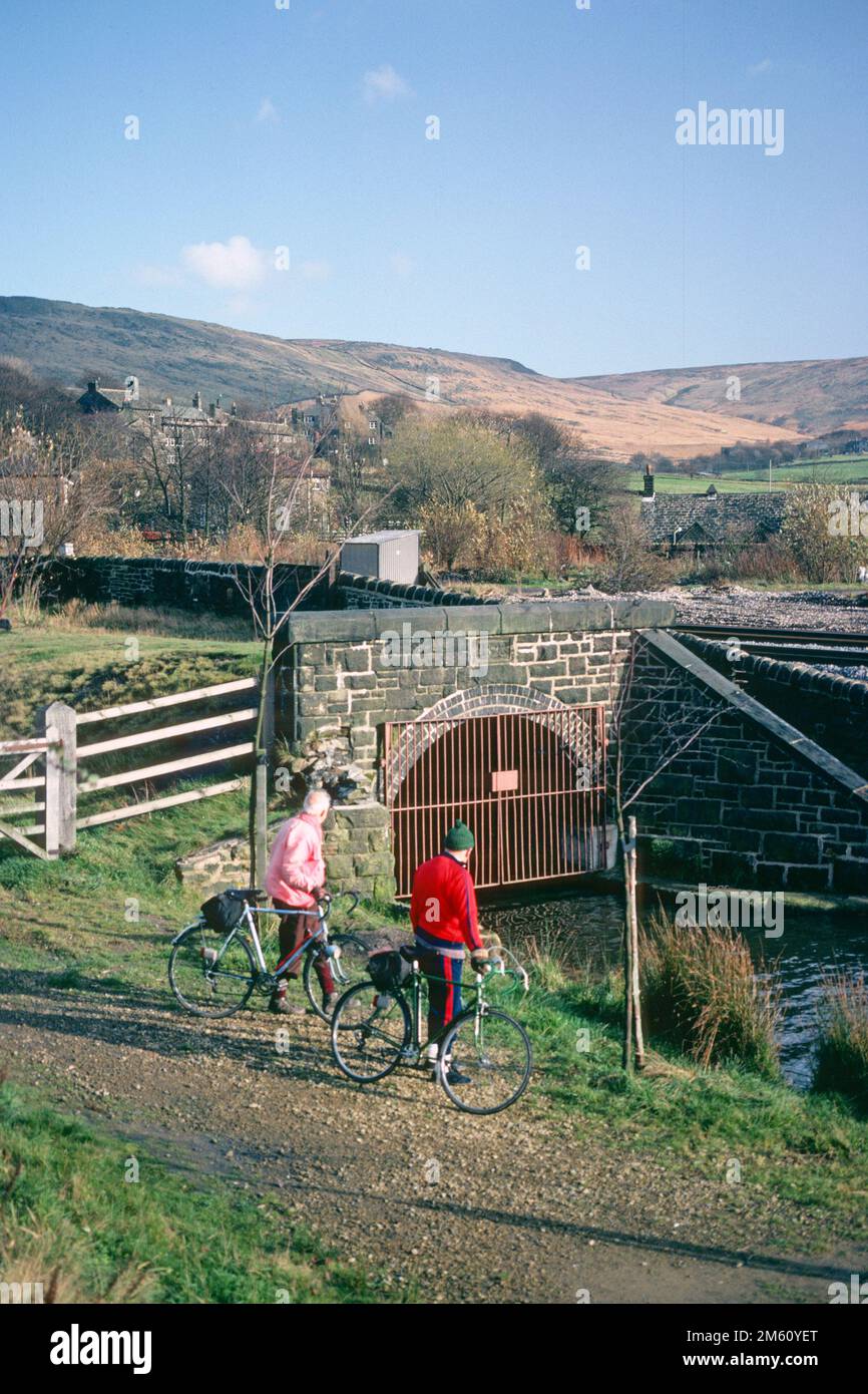 Two elderly men with bicycles beside Standedge canal tunnel in 1982 prior to restoration, Diggle, Greater Manchester Stock Photo