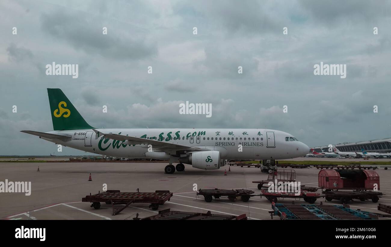 Airbus a320 of Spring Airlines in Park Position in Shanghai Pudong Airport, China Stock Photo