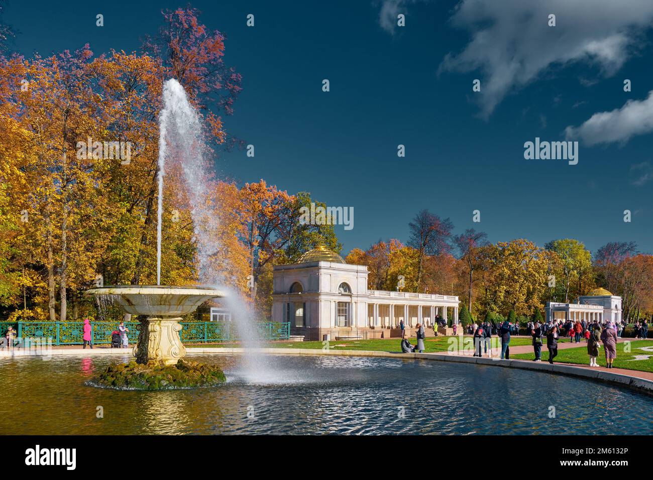 People walking in the lower park of Peterhof, in the foreground