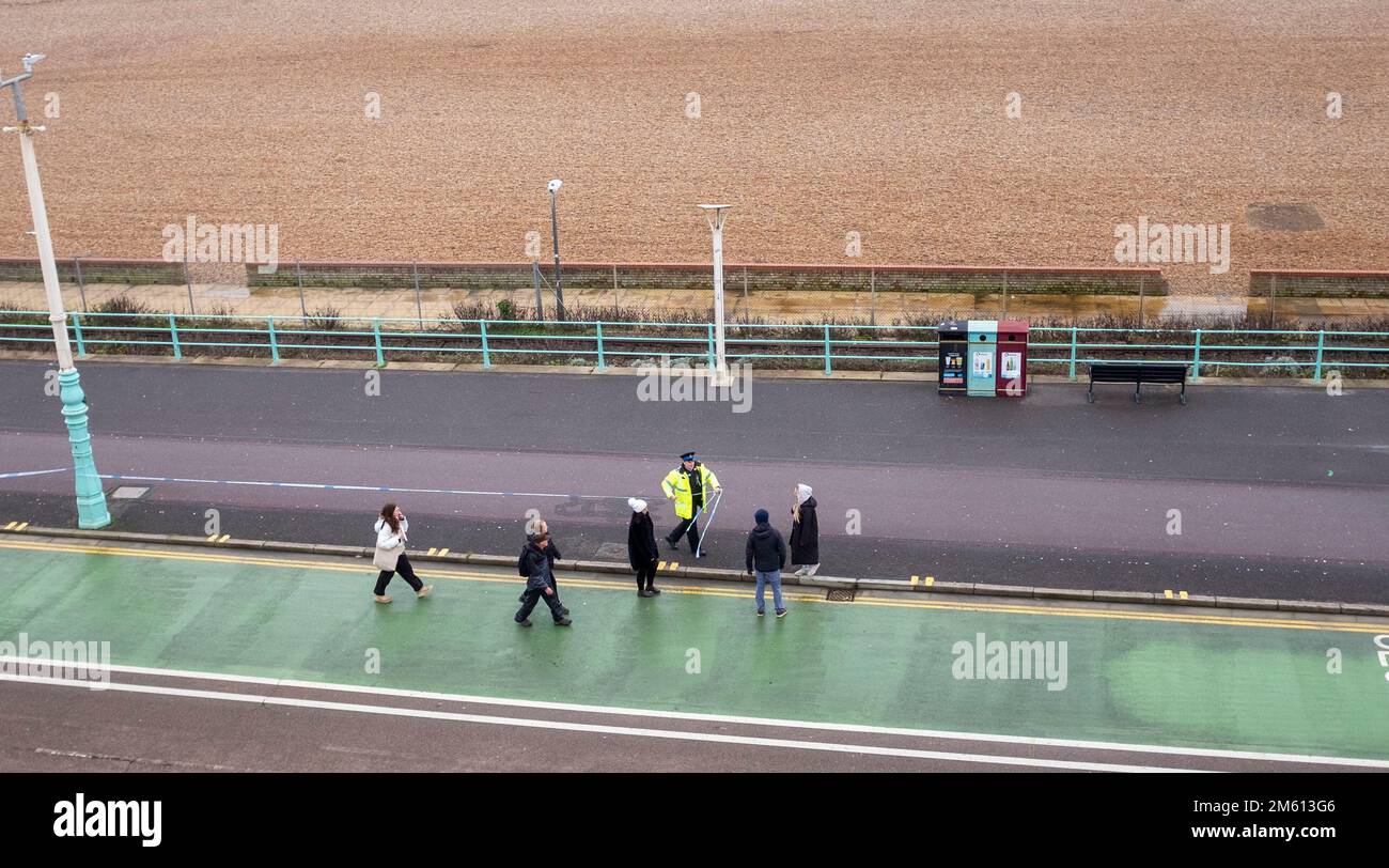 Brighton UK 1st January 2023 - Police evacuate a part of Brighton beach to the east of Brighton Palace Pier after a WW2 shell was discovered washed up . Members of the Royal Navy Bomb Disposal team exploded the device in the mid afternoon  : Credit Simon Dack / Alamy Live News Stock Photo