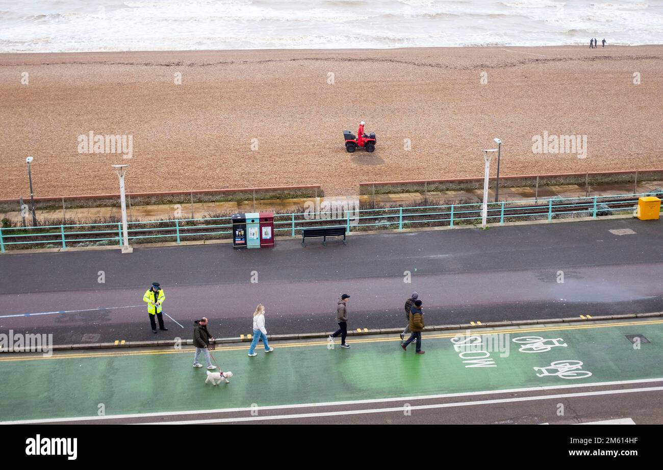 Brighton UK 1st January 2023 - Police evacuate a part of Brighton beach and seafront to the east of Brighton Palace Pier after a WW2 shell was discovered washed up . Members of the Royal Navy Bomb Disposal team exploded the device in the mid afternoon  : Credit Simon Dack / Alamy Live News Stock Photo