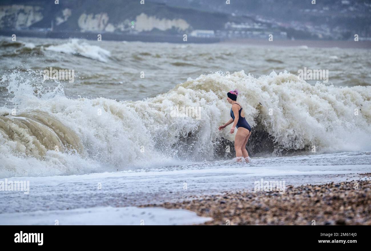 Seaford, UK. 1st Jan, 2023. UK weather: Swimmers celebrating New Year's Day by bravely testing the stormy seas at Seaford in East Sussex, UK. Credit: Jim Holden/Alamy Live News Stock Photo
