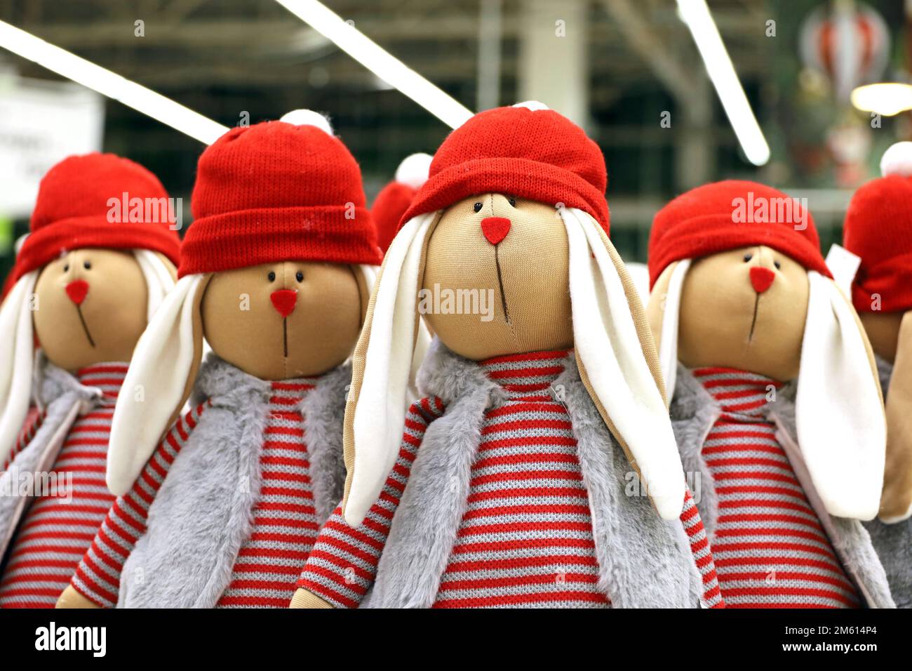Christmas rabbits in a store. Symbol of Chinese New Year 2023, souvenir dolls Stock Photo