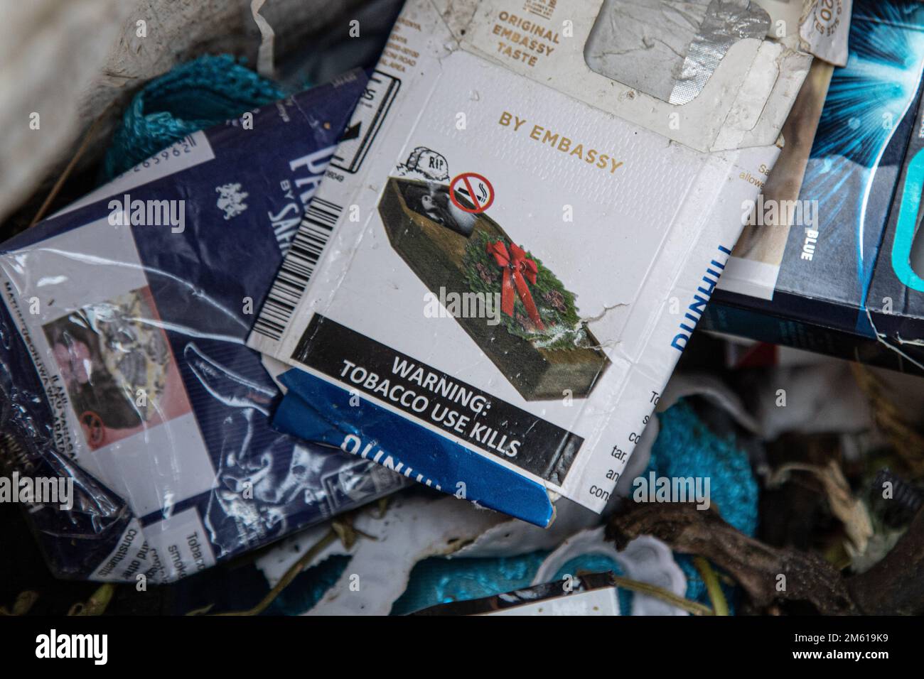 An empty packet of Dunhill Cigarettes with a health warning written 'Tobacco Use Kills' and a coffin symbol printed on it litters the environment near a popular entertainment spot in Nakuru. A study conducted by researchers at California’s UC Davis Comprehensive Cancer Center says nearly half of the deaths from 12 cancers are due to tobacco use. Stock Photo