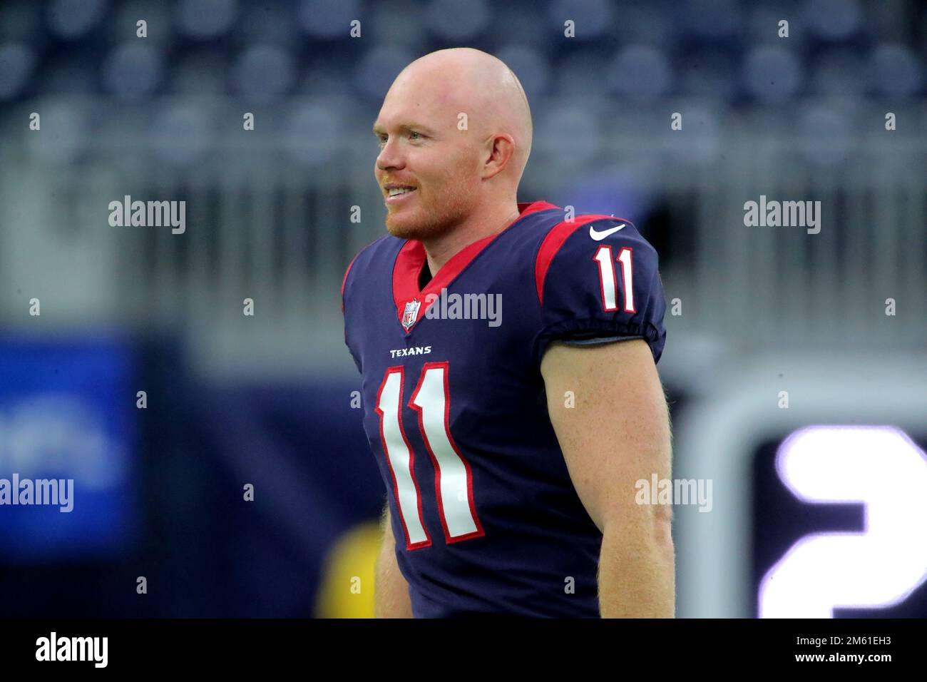 Houston Texans punter Cameron Johnston (11) tosses a bottle during warm-ups  before an NFL football game against the Jacksonville Jaguars on Sunday, Oct.  9, 2022, in Jacksonville, Fla. (AP Photo/Gary McCullough Stock