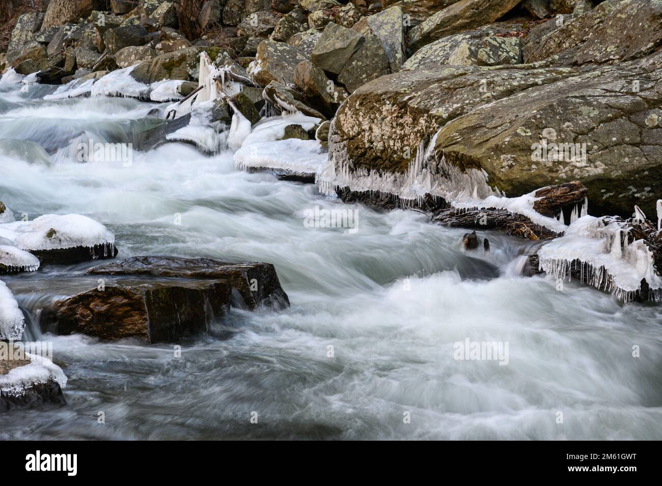 The icy cascades of Deer Creek in Rocks State Park in Maryland as seen