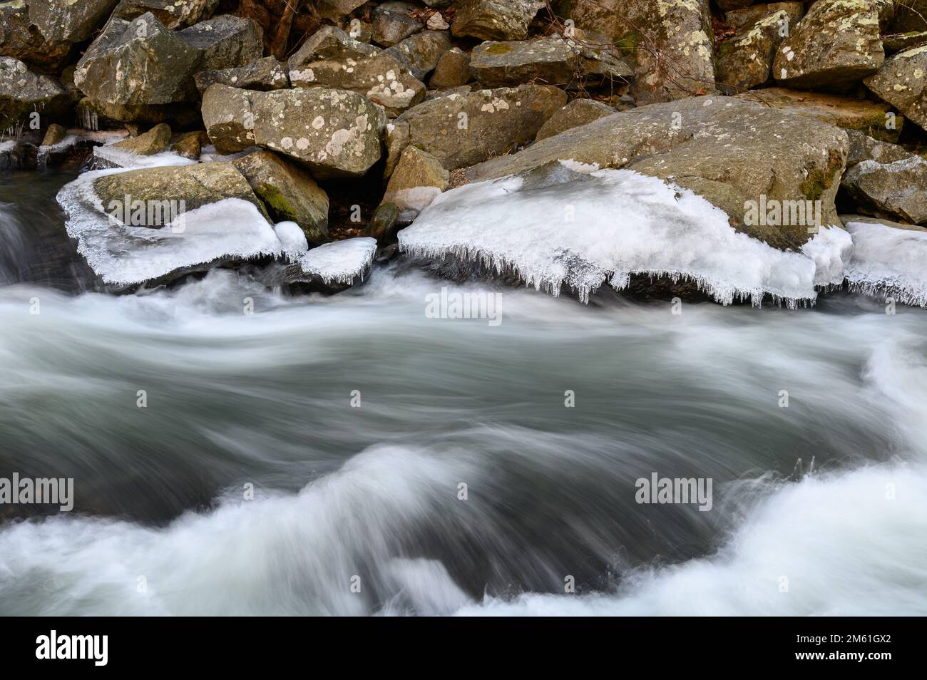 The icy cascades of Deer Creek in Rocks State Park in Maryland as seen after Storm Elliott in late December 2022 Stock Photo