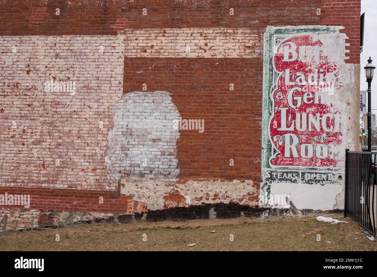 Ghost writing on a buildings brick wall Stock Photo