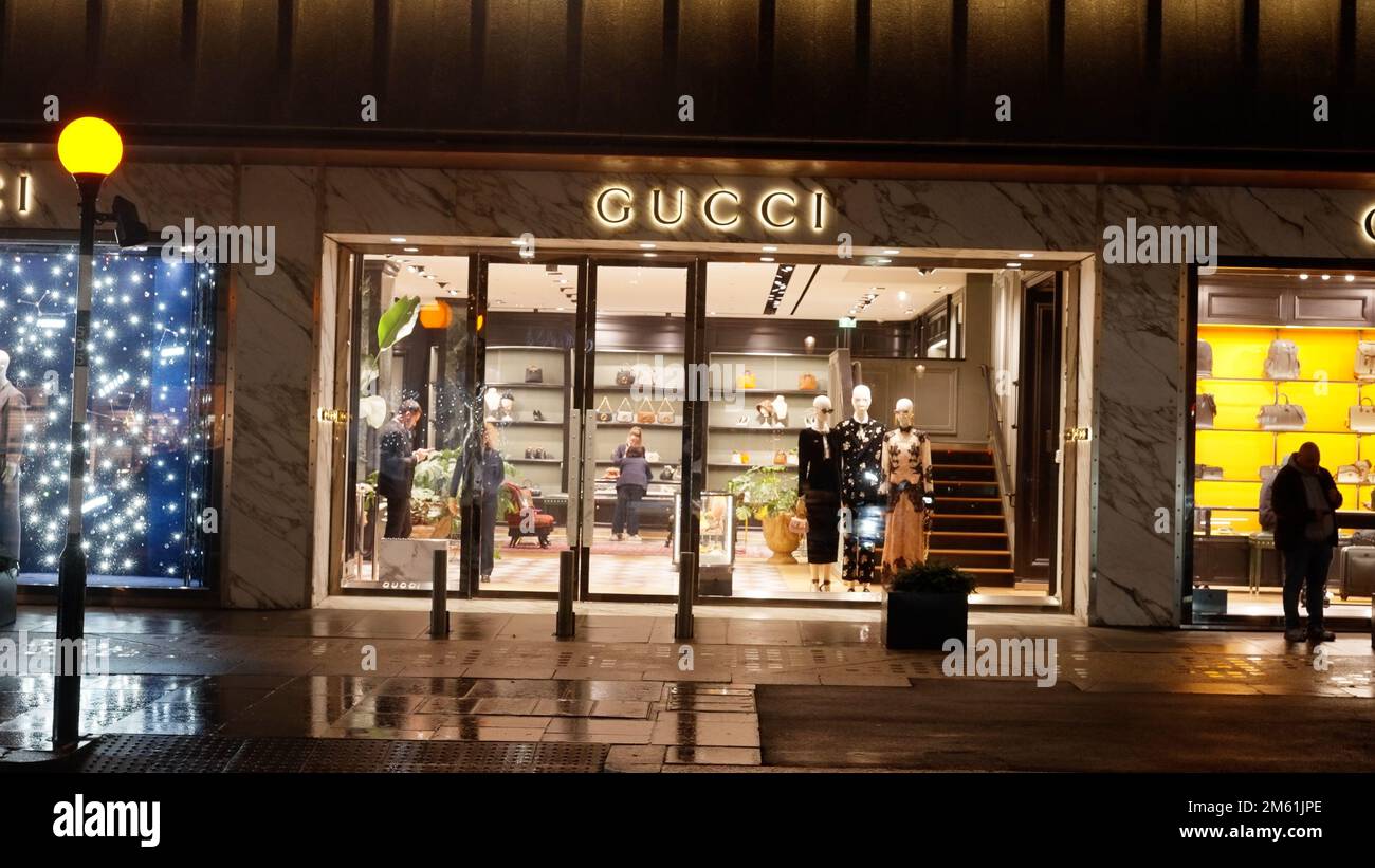 Gucci store in London at night - LONDON, UK - DECEMBER 20, 2022 Stock Photo