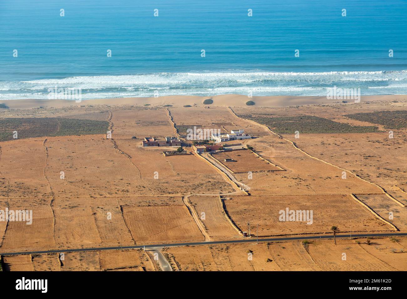 View over coastal plain to Atlantic Ocean coastline from Tamellalt, southern Morocco, north Africa, Stock Photo