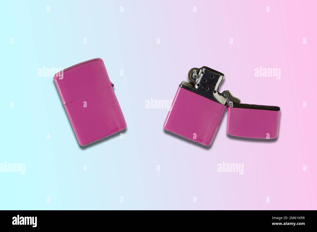pink lighter closed and open on blue background, creative holiday design Stock Photo