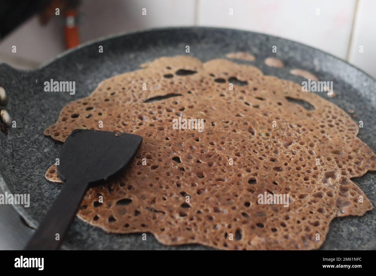 Instant Finger Millet Dosa, made with finger millet flour, curd and