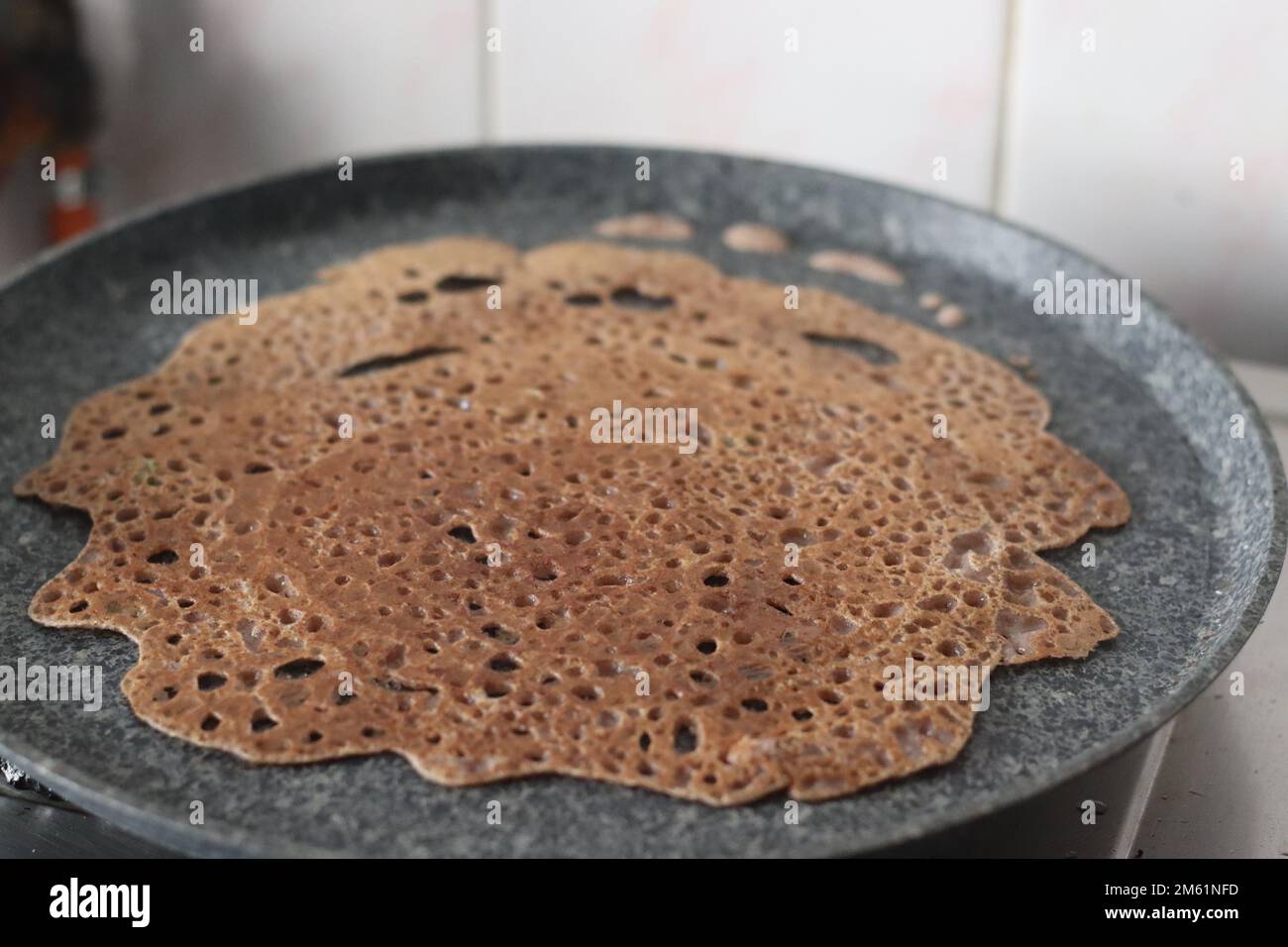 Instant Finger Millet Dosa, made with finger millet flour, curd and