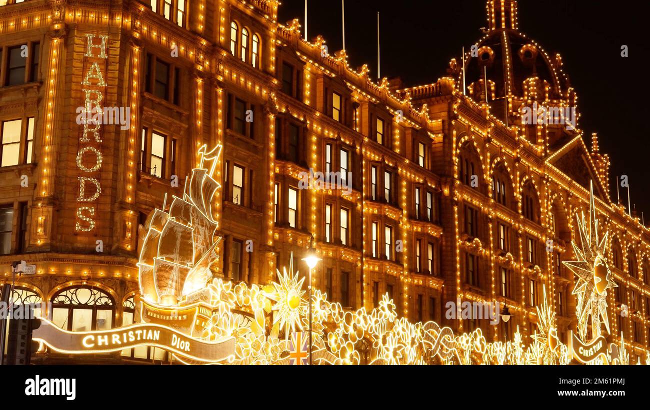 Harrods Department store in London at night - LONDON, UK - DECEMBER 20, 2022 Stock Photo
