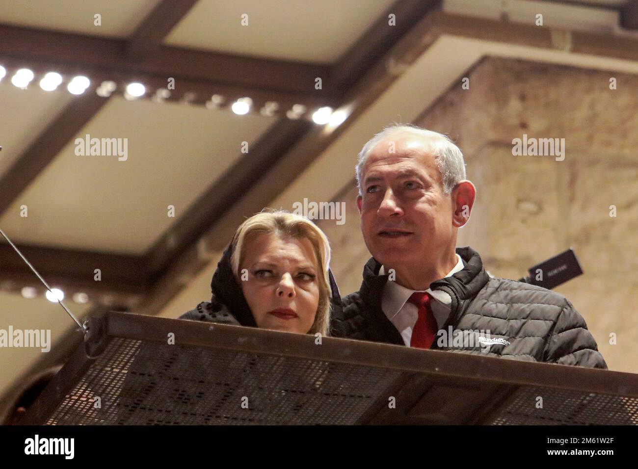 Jerusalem, Israel. 01st Jan, 2023. Israel's Prime Minister Benjamin Netanyahu (R) and his wife Sara Netanyahu (L) visit the Western Wall, the holiest site where Jews are allowed to pray, to mark the swearing-in of the 37th government of Israel, in the old city of Jerusalem on January 1, 2023. Pool Photo by Gil Cohen-Magen/UPI Credit: UPI/Alamy Live News Stock Photo
