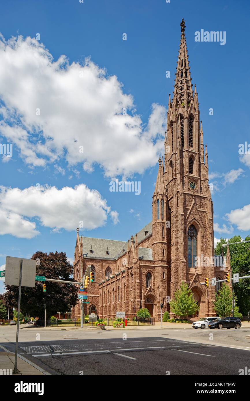 St. Louis Roman Catholic Church is the third to be built on the site. The church is known for its stained glass and open-work steeple with clock. Stock Photo