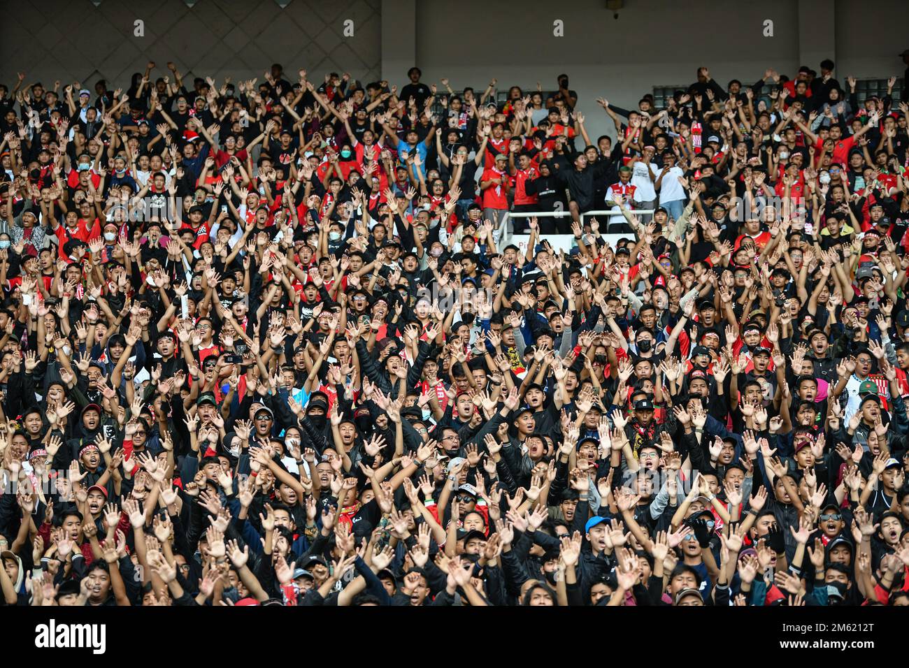 Jakarta, Indonesia. 29th Dec, 2022. Indonesia fans cheer during the AFF Mitsubishi Electric Cup 2022 match between Indonesia and Thailand at the Gelora Bung Karno Stadium. Final score; Indonesia 1:1 Thailand. (Photo by Amphol Thongmueangluang/SOPA Images/Sipa USA) Credit: Sipa USA/Alamy Live News Stock Photo