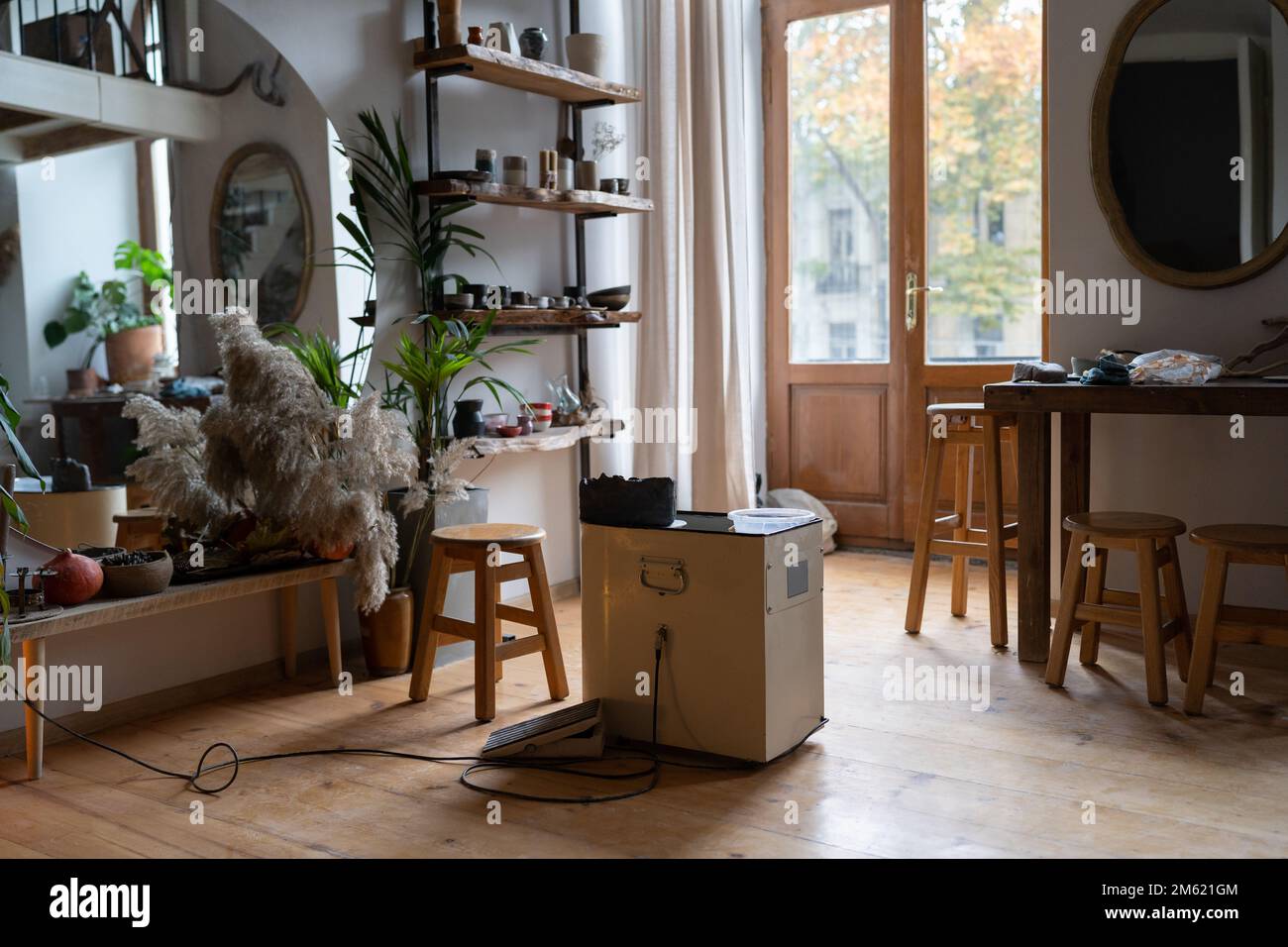 Cozy home pottery studio or ceramics workshop with handmade products on  shelves Stock Photo - Alamy