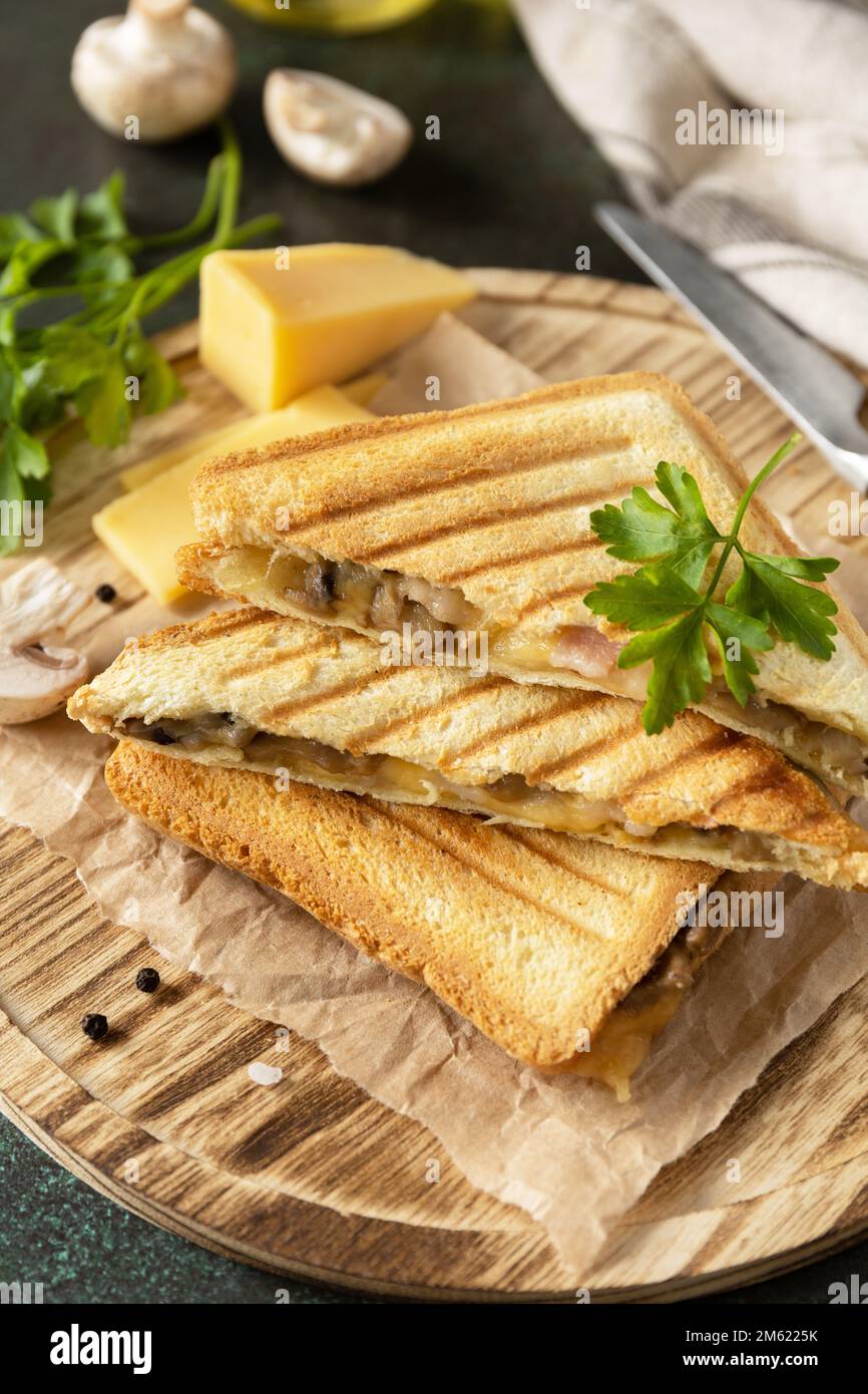 Delicious sandwich with grilled cheese, bacon and mushroom. Homemade