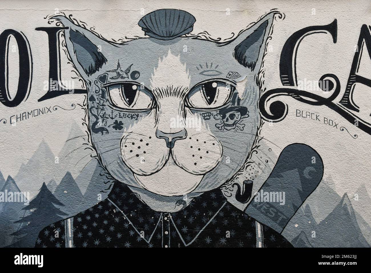 Close-up of a mural depicting a smartly dressed cat in comic style on the exterior wall of a restaurant, Chamonix-Mont-Blanc, Haute Savoie, France Stock Photo