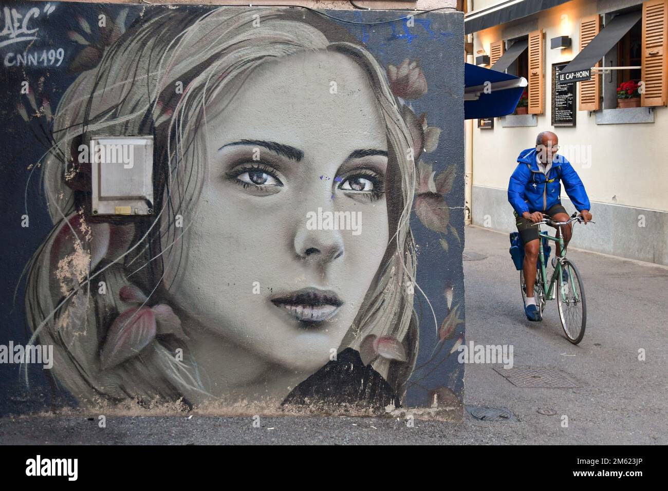 Detail of a mural by the street artist Laetitia Cefali depicting the portrait of a girl on a wall in Rue des Moulins, Chamonix, Rhone Alpes, France Stock Photo