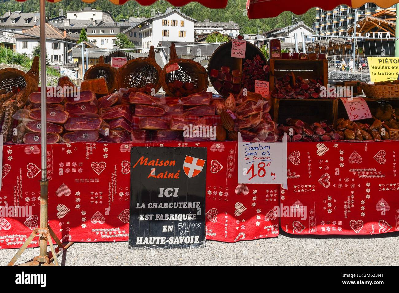 Typical cold cuts stand at the street market of Chamonix in summer