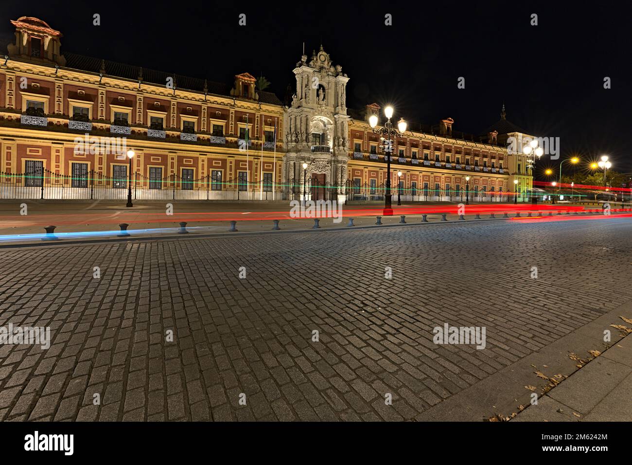 Palace of San Telmo photographed at night with long time exposure. Some vehicles were moving by. Stock Photo