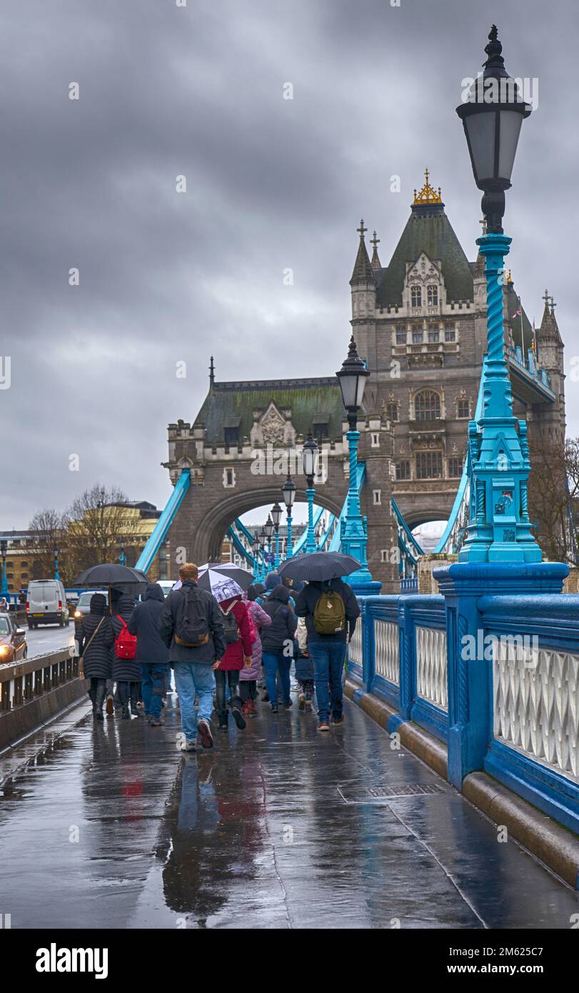 london tourists in the rain   tower bridge Stock Photo