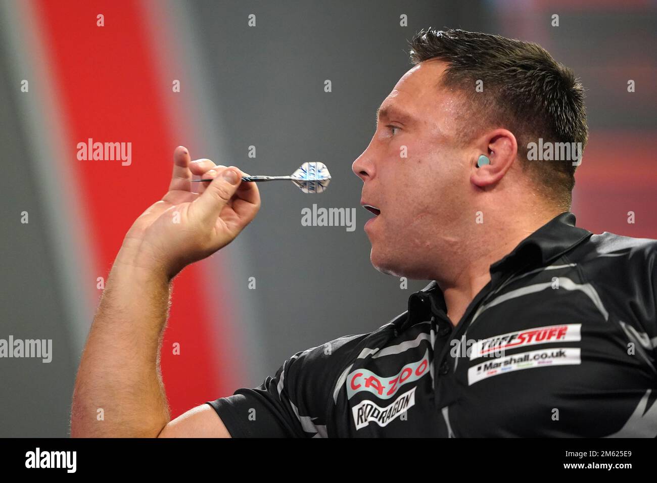 præsentation Barcelona absorption Gerwyn Price can be seen wearing ear defenders during his match against  Gabriel Clemens on day