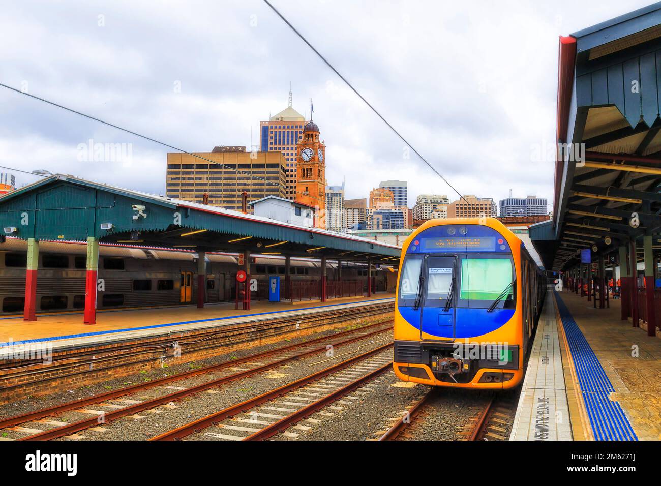 Cityscape of Sydney Central station with intercity overland train onboarding at passenger