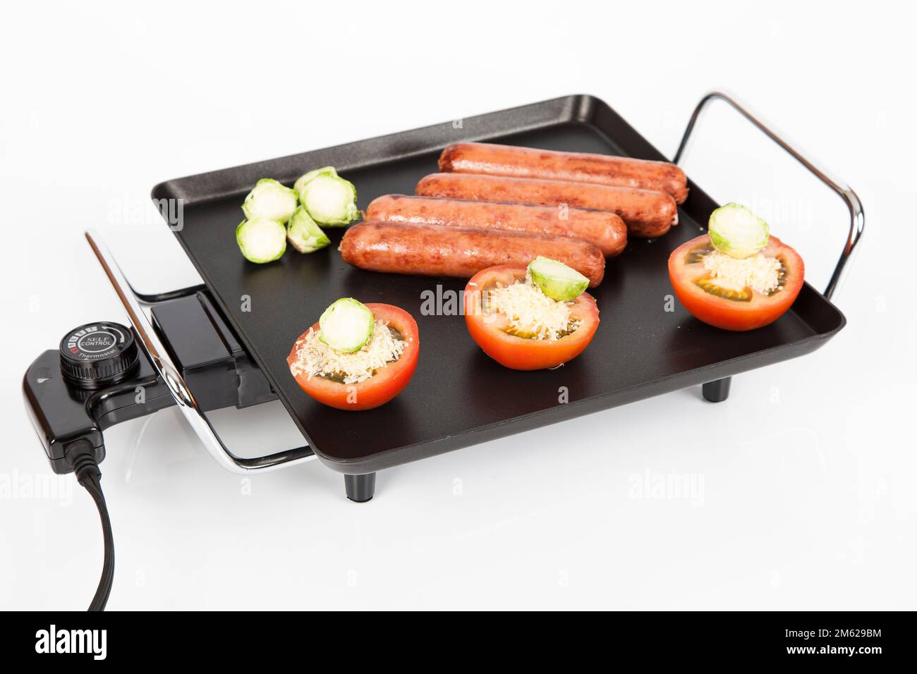 Electric griddle for cooking; photo on white background Stock Photo Alamy